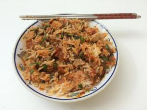 Pasta sauce and meat with steam white rice and veggies